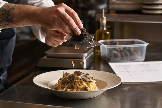 Restaurant Operator’s Guide to Choosing Truffle Products. Restaurant Operator’s Guide to Choosing Truffle Products. Chef shaving a fresh black truffle over pasta at a restaurant pa